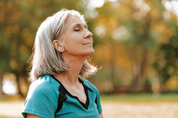 smiling profile of a woman outdoors